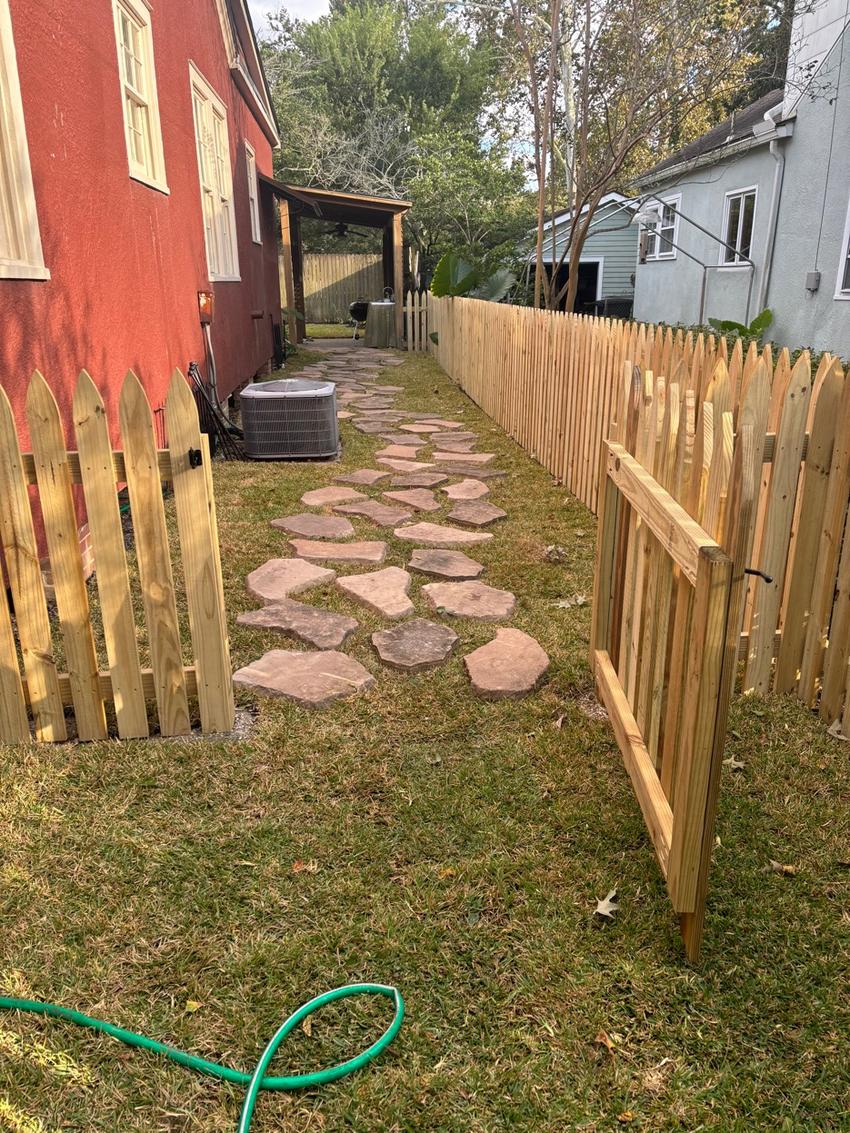 Cedar picket fence with flagstone path installed in Baton Rouge