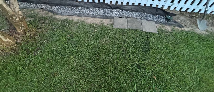 French drain with gravel channel and landscape fabric - Baton Rouge drainage contractor